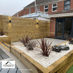 Flower bed retaining wall